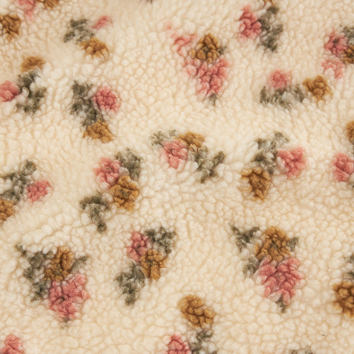 Close-up swatch of the Amber print sherpa fabric, square crop