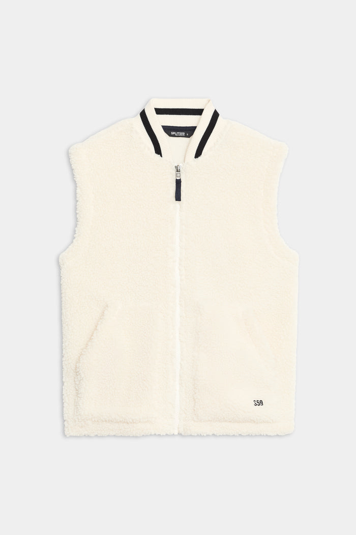 The SPLITS59 Aster Sherpa Vest is a sleeveless white fleece vest with a front zipper, ribbed collar, two front pockets, and "550" text near the hem.