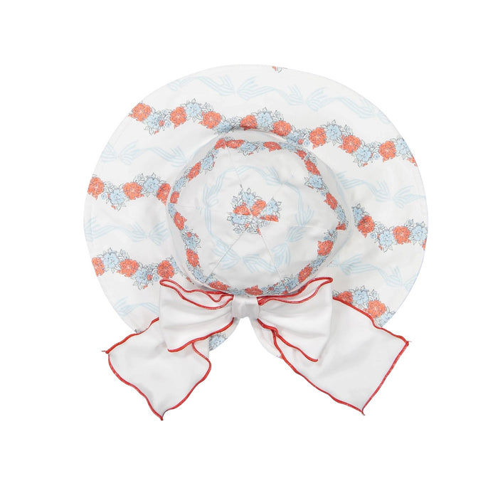 Breeze Lycra Sunny Hat in coral floral-and-bow print with coral piping and oversized white bow