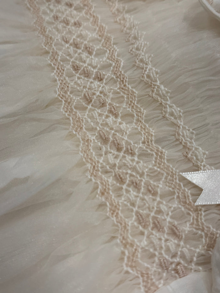 Close-up of delicate ivory handwork on Brice Boy Handsmocked Romper