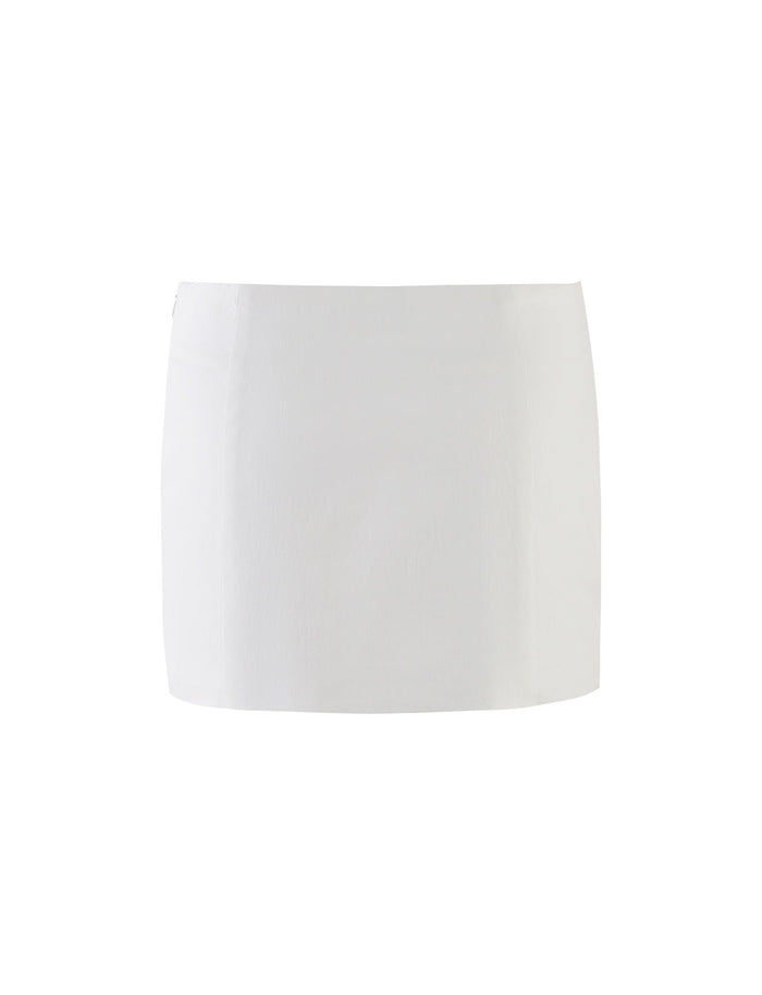 The HALSEY SKIRT - WHITE : CREAM from TIGERMIST is a simple, seamless white mini skirt showcased against a minimalist white background, embodying the chic elegance characteristic of the brand.