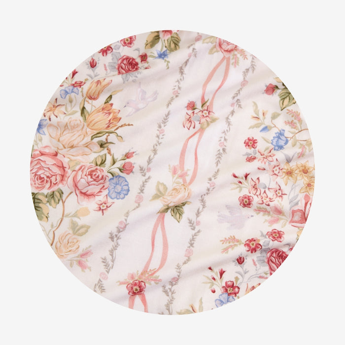 Close-up swatch of the Janey print fabric, circle crop