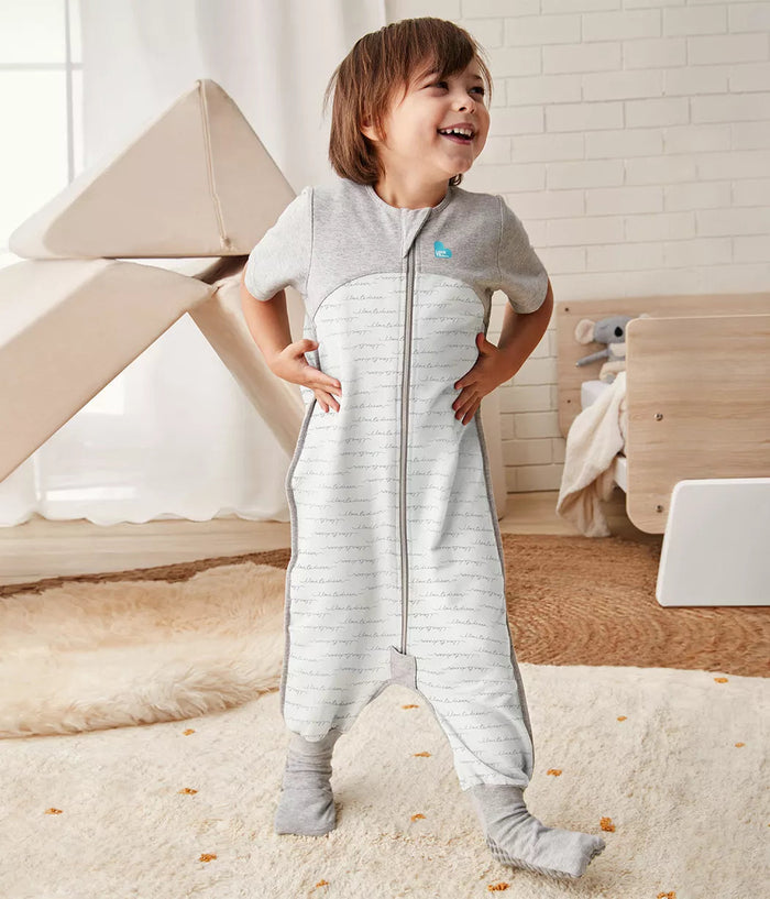 Child wearing gray and white striped Love To Dream Sleep Suit, Tog Dreamer White