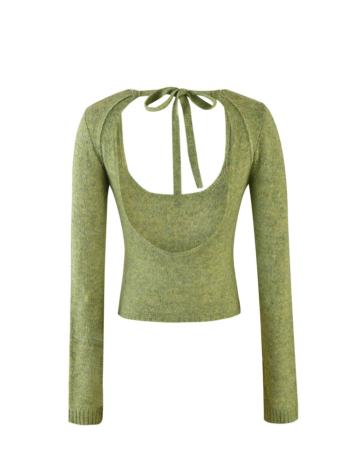 The LYRICA JUMPER - GREEN from TIGERMIST is a green, long-sleeved, cropped sweater featuring an open back design with a scoop cut-out secured by a tie at the neck. The knit fabric appears soft and slightly textured.