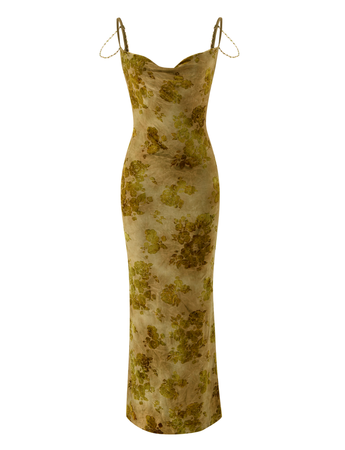 The TIGERMIST SPARROW MAXI DRESS - GREEN BURNOUT is a fitted, floor-length dress with thin spaghetti straps and a yellow-green floral pattern on beige, shown on a plain white surface.