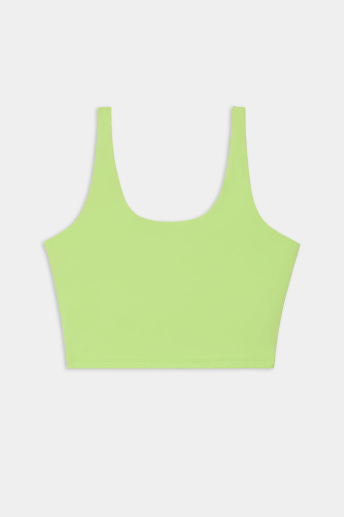 A SPLITS59 Sprint Rigor Bralette in Limeade, featuring wide shoulder straps and an ultra-light design for multi-sport performance, displayed on a plain white background.