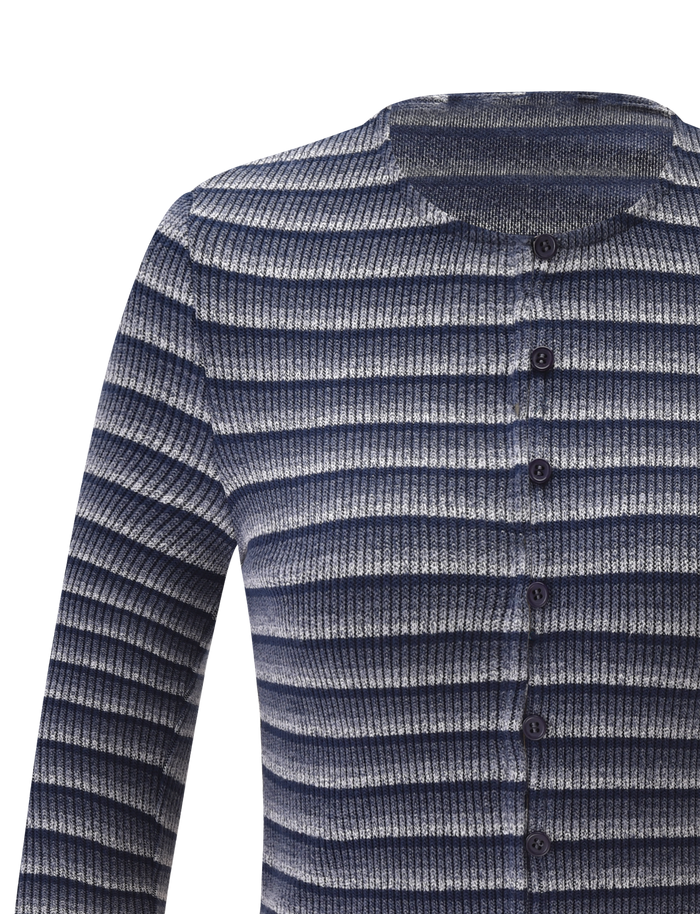 A close-up of the TIGERMIST TIMARA CARDIGAN - NAVY STRIP shows its long sleeves, ribbed knit texture, and mini front buttons. The navy, gray, and white horizontal stripes stand out against a plain white background.