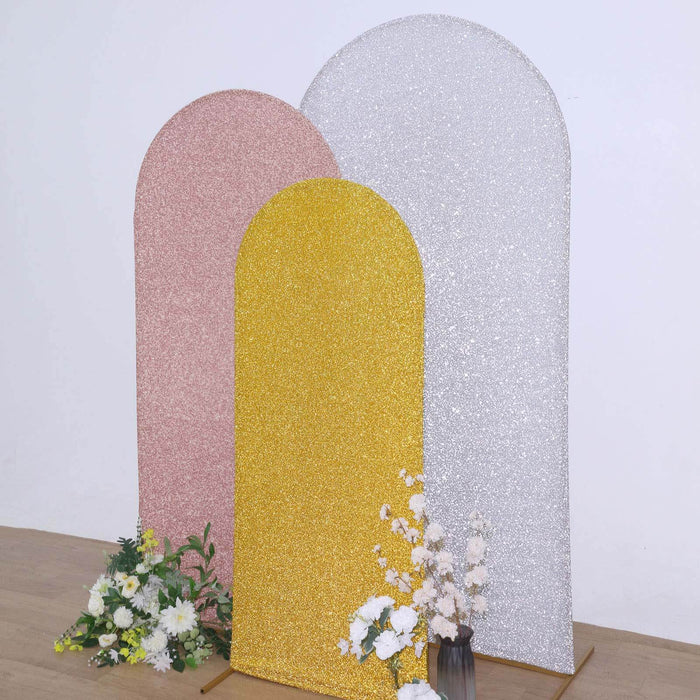 Glittery decorative backdrops in pink, gold, and silver with flowers