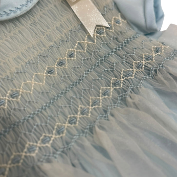 Close-up of intricate handsmocking on Agustin Light Blue Boy Romper
