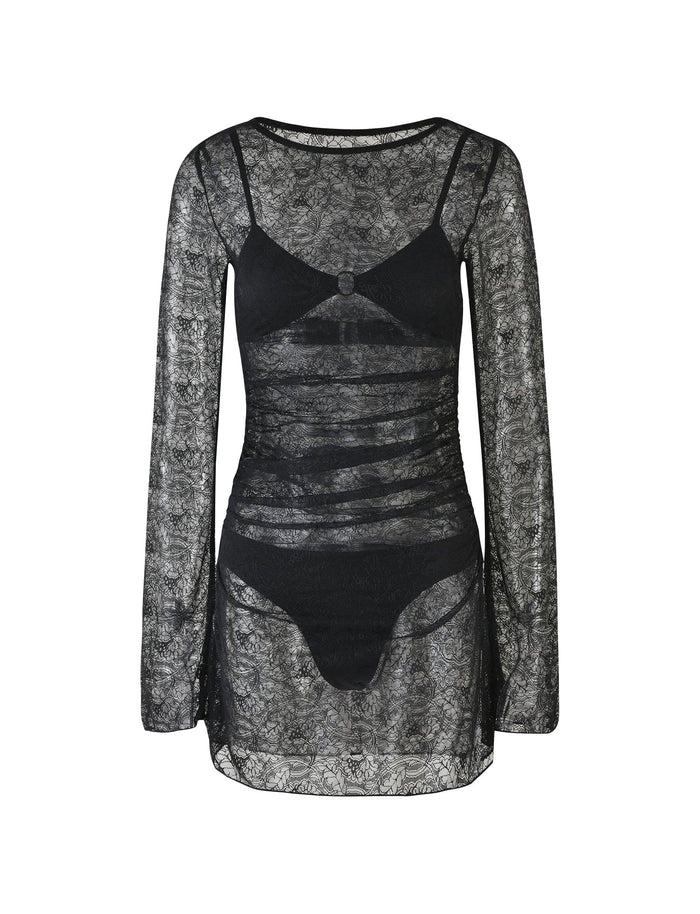 The ALAYNA THREE PIECE MINI DRESS from TIGERMIST is a black, sheer lace dress featuring long sleeves and a mesh-like texture. The slim-fit, short-length dress reveals a black strappy bralette and high-waisted underwear beneath the intricate lace fabric.
