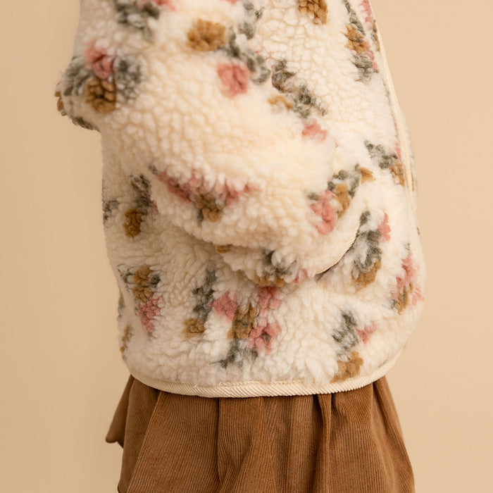 Close-up of the funnel collar and zipper detail on the Amber print sherpa jacket