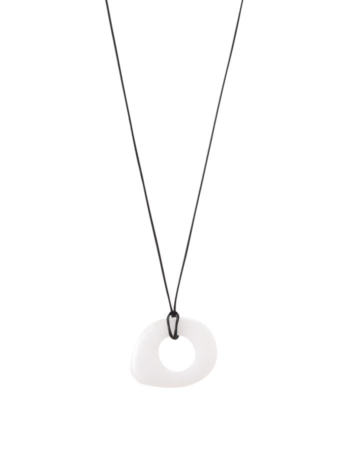The TIGERMIST AMYRA PENDANT NECKLACE - WHITE features a minimalist design with a black adjustable cord and an irregular white donut-shaped pendant, shown on a plain white background.