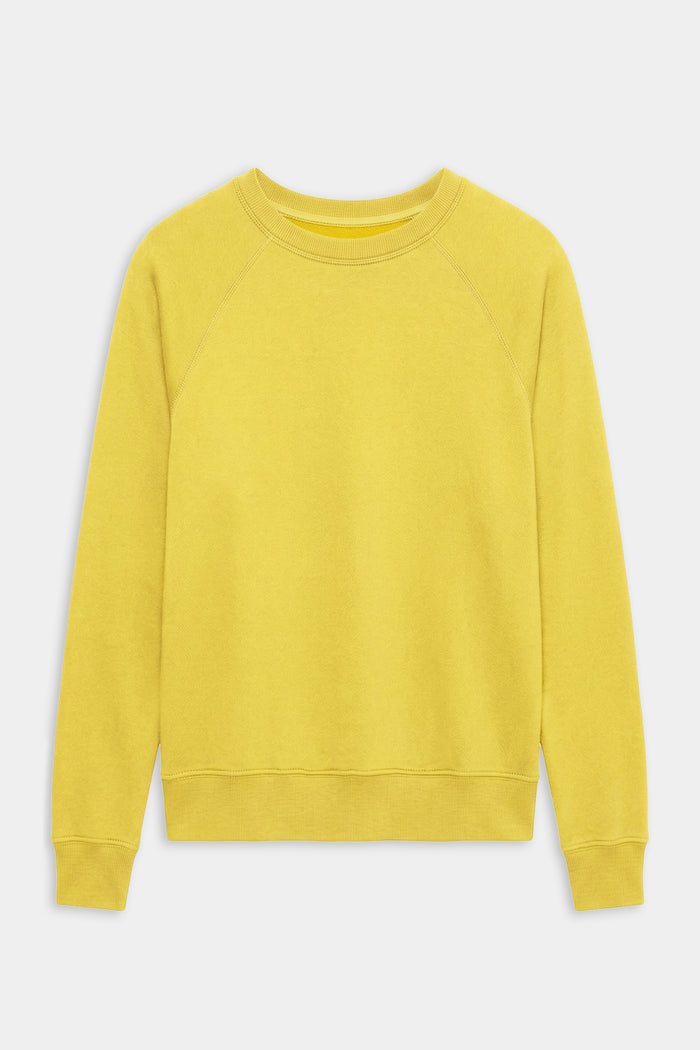 The SPLITS59 Andie Oversized Fleece Sweatshirt in Bright Yellow, featuring long sleeves and a crewneck, is shown laid flat on a white background. Made in Los Angeles.