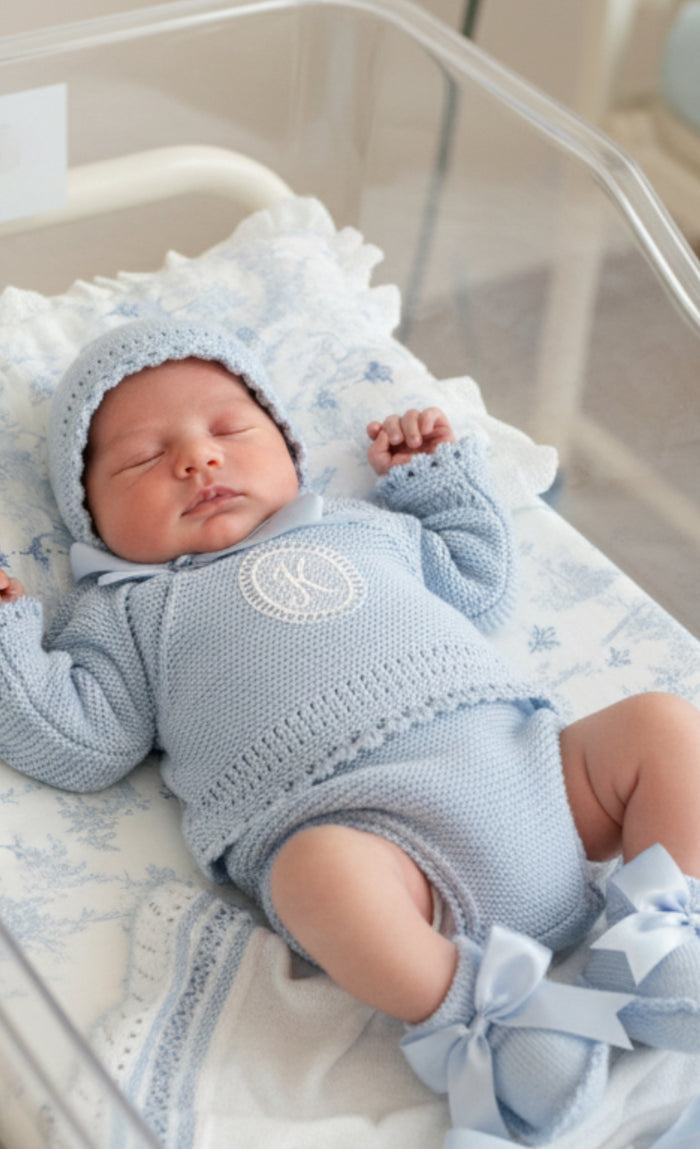 Baby wearing light blue Andy Initial Knitted set with personalized initial