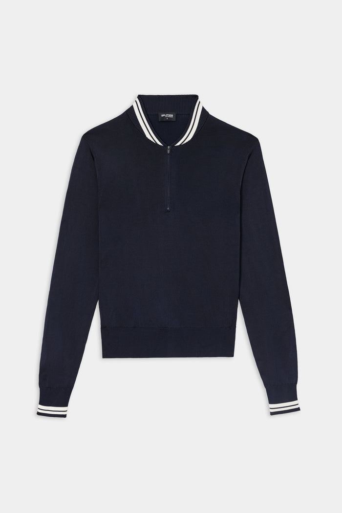 The SPLITS59 Bonnie Knit Half Zip in Indigo/White is a long-sleeve pullover crafted from a soft rayon and nylon blend, featuring a quarter-zip closure and white-striped ribbed collar and cuffs, displayed laid flat on a white background.