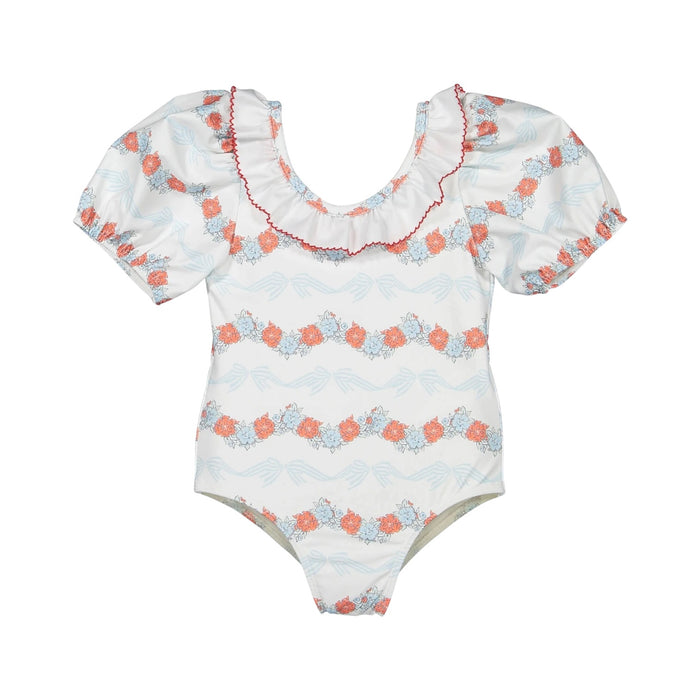Breeze Floral Swimsuit in coral floral-and-bow print with ruffled neckline and coral piping