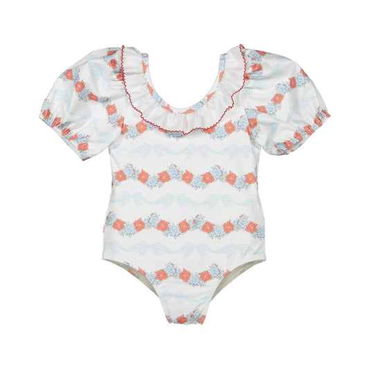 Breeze Floral Swimsuit in coral floral-and-bow print with ruffled neckline and coral piping