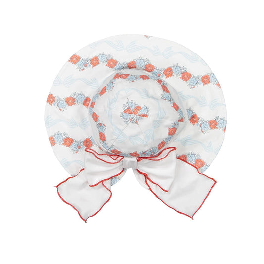Breeze Lycra Sunny Hat in coral floral-and-bow print with coral piping and oversized white bow