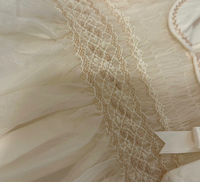 Close-up of tonal ivory handsmocking on Brice Boy Romper