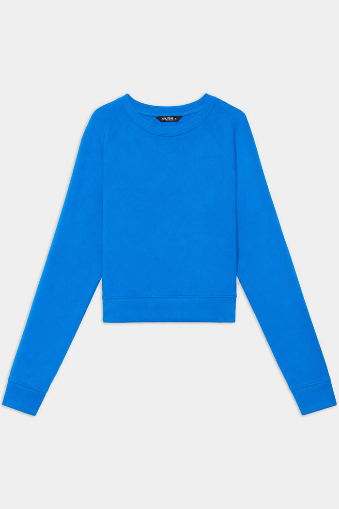 The SPLITS59 Brooks Fleece Long Sleeve Sweatshirt in Classic Blue is laid flat on a white background.