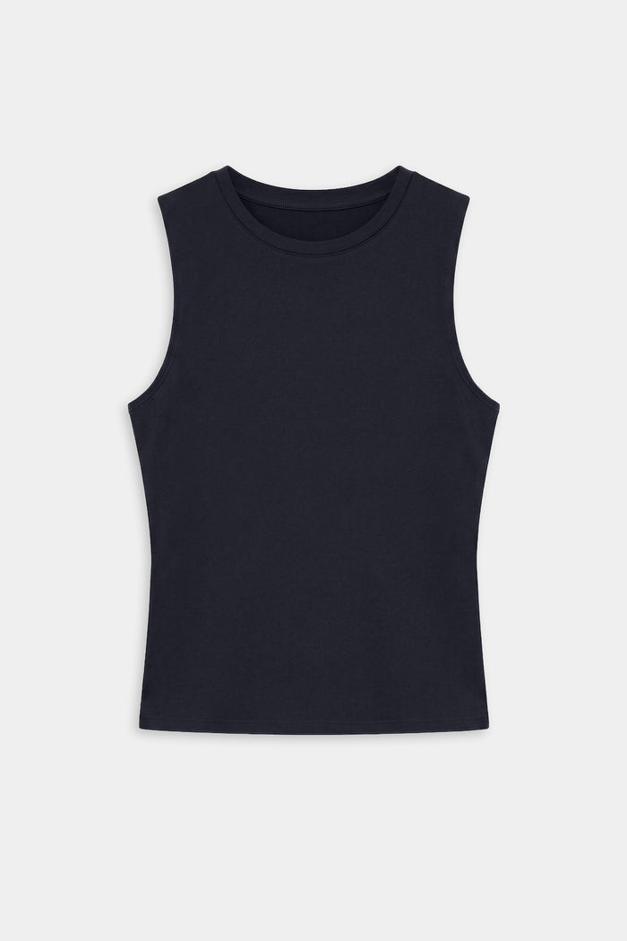 The Carter Airweight Lite Tank by SPLITS59 in indigo, sleeveless, is laid flat on a plain white background, showcasing its buttery soft performance fabric.