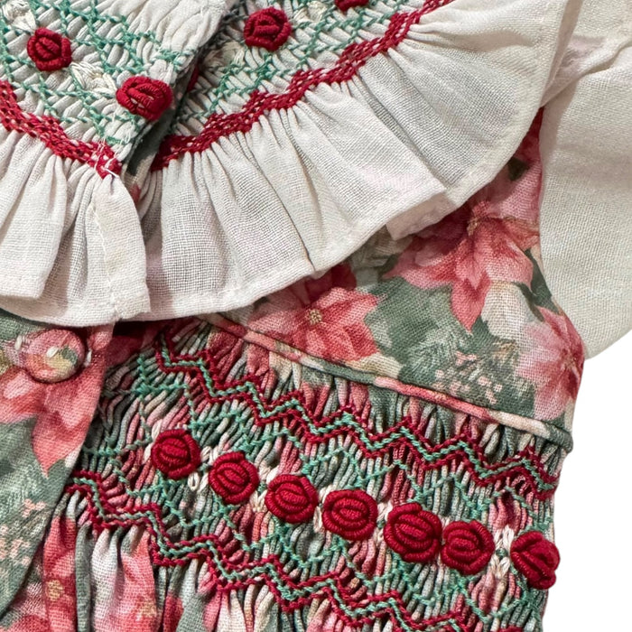 Close-up of handsmocking and red floral detailing on Christmas Florals Dress
