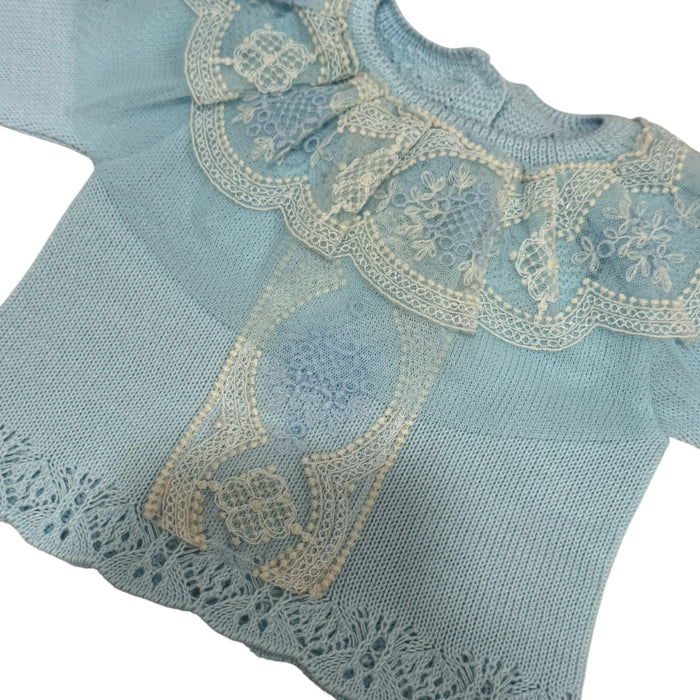 Close-up of ivory lace and ribbon detailing on Clotilde Light Blue knitted top
