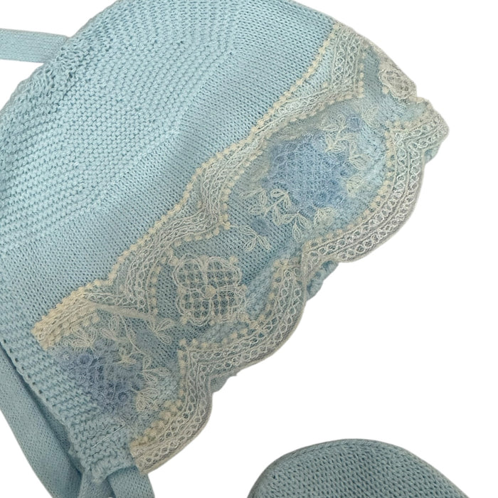 Close-up of ivory lace detailing on Clotilde Light Blue knitted bonnet
