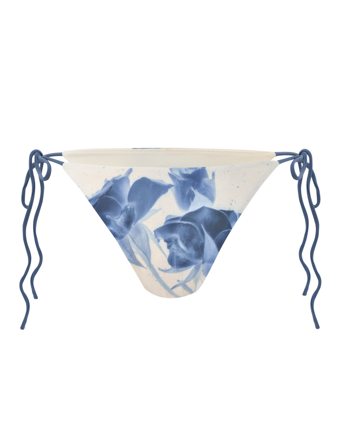 The CYLAS BIKINI BOTTOM by TIGERMIST features an indigo floral rose print in a monochrome design on a white background.