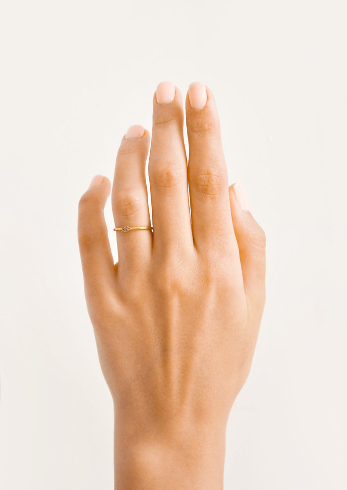 Model shot showing hand wearing diamond ring.