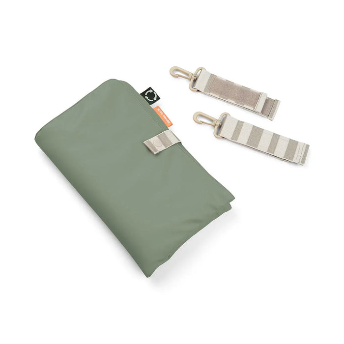 Folded green deer quilted changing pad with interior insulated pocket and exterior zip closure