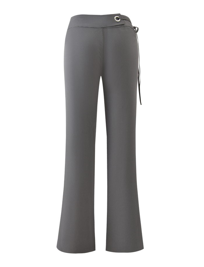 The EMORY PANT - GREY PINSTRIPE by TIGERMIST features a high-waisted, flared silhouette with a fitted waist and grommet-tie detail on the right side, shown from the back.