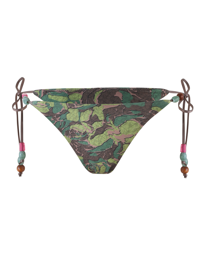 The FINLEA BIKINI BOTTOM - GREEN : CAMO by TIGERMIST features a green and brown camo leaf print, cheeky cut, and adjustable side ties with pink, green, and brown beads for a playful look.