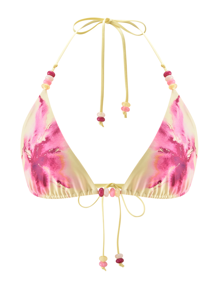 The FINLEA BIKINI TOP - WATERCOLOUR FLORAL by TIGERMIST features a yellow triangle design with a watercolour floral and pink-purple tie-dye print, plus adjustable straps embellished with pink, red, and white beads.