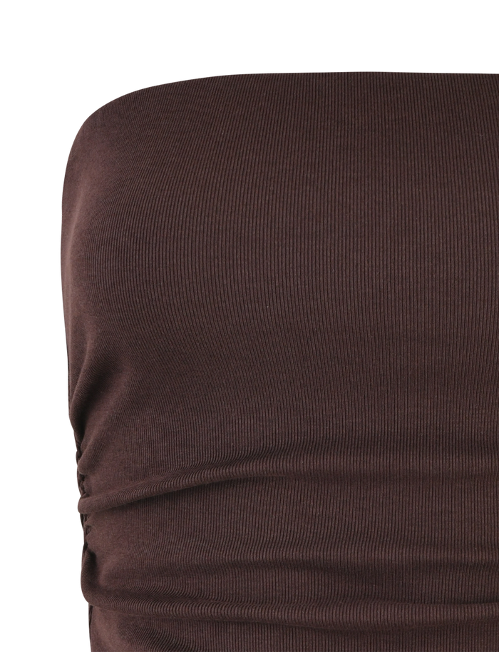 Close-up of the TIGERMIST HARRIETT RIB TOP in Chocolate Brown, featuring fitted, ribbed jersey with gathered side details. The smooth, stretchy material highlights a bodycon silhouette ideal for a sleek look.