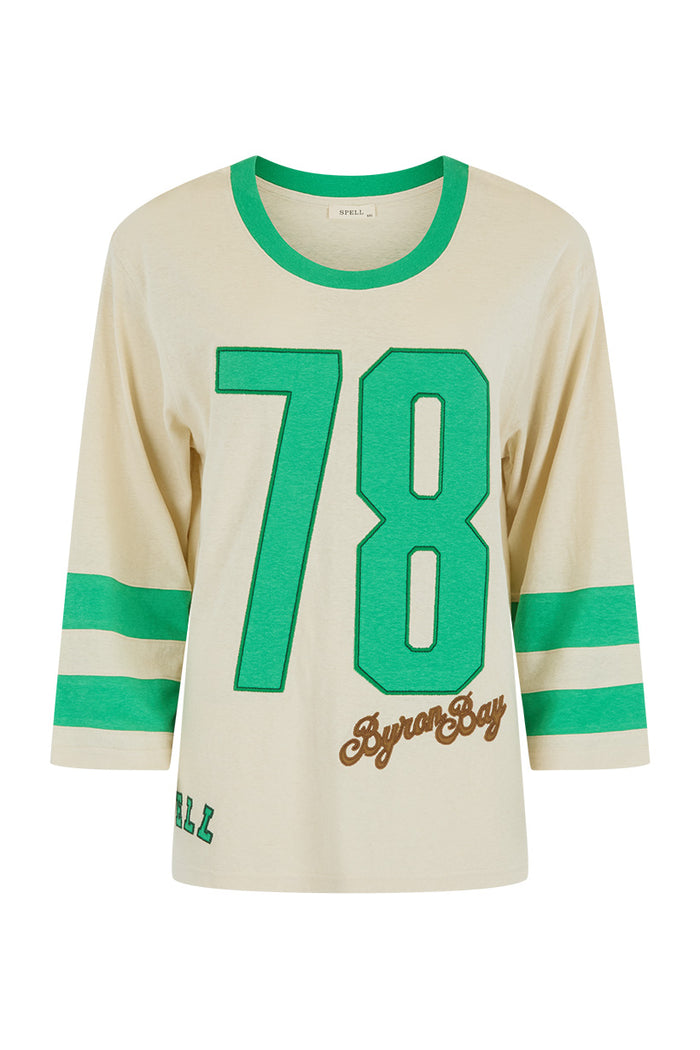 Flat lay front view of cream hemp-organic cotton tee with green 78 Byron Bay applique and contrast sleeve stripes