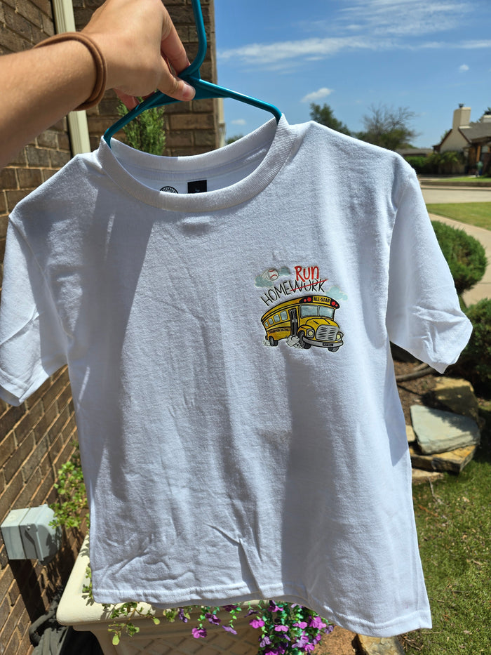 White youth short-sleeve t-shirt featuring a vintage yellow school bus graphic with "Home Run" text, baseball and softball athletic apparel