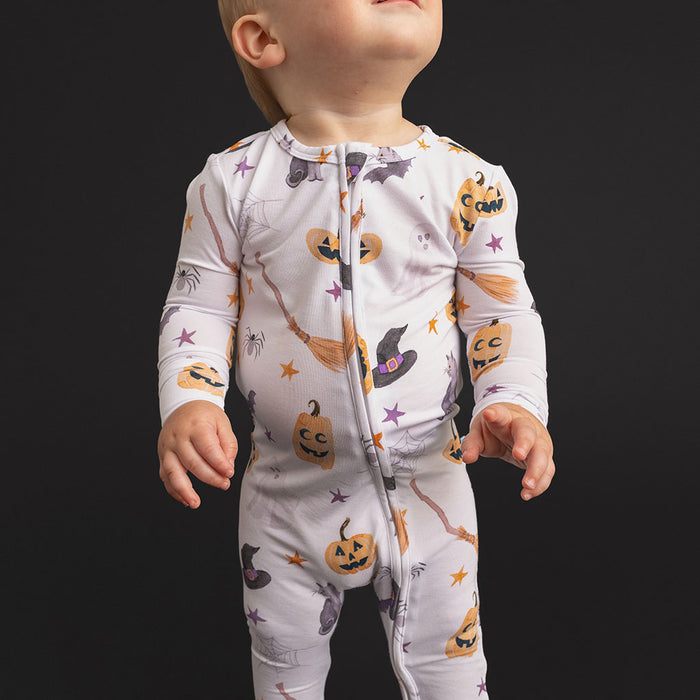 Close-up of a baby wearing the Posh Peanut Irving Convertible One Piece.