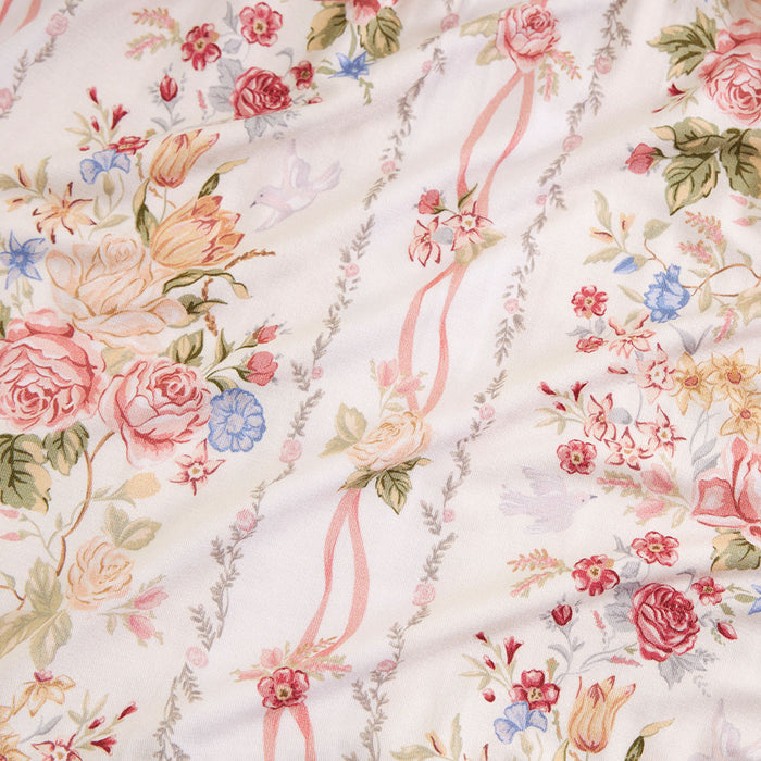 Close-up swatch of the Janey print fabric, square crop