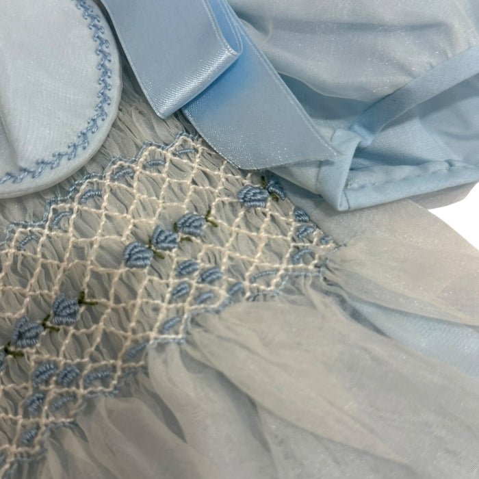 Close-up of handsmocking and light blue collar detailing on Joaquin Romper