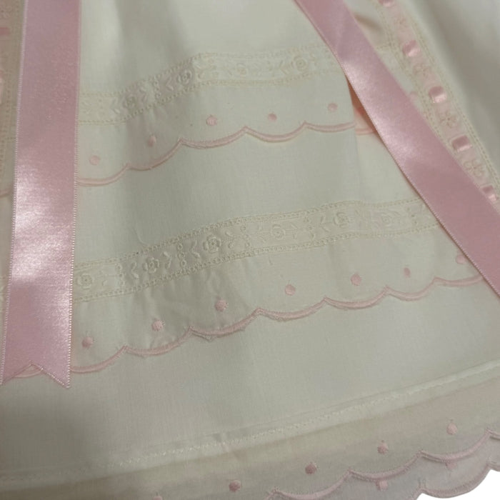 Close-up of pink ribbon and ivory lace detailing on Larissa Faldon Skirt