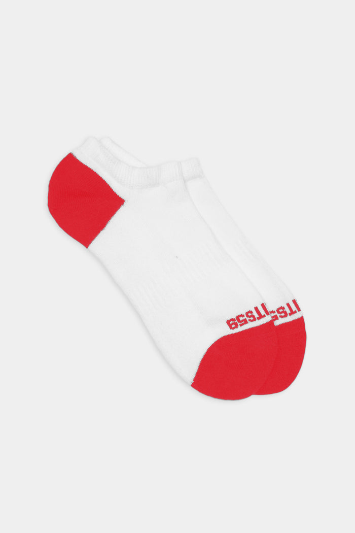 The SPLITS59 Logo Ankle Socks in White/Pirate Red feature red heels, toes, and logo text on the toe, offering a subtle retro athletic vibe on a clean background.
