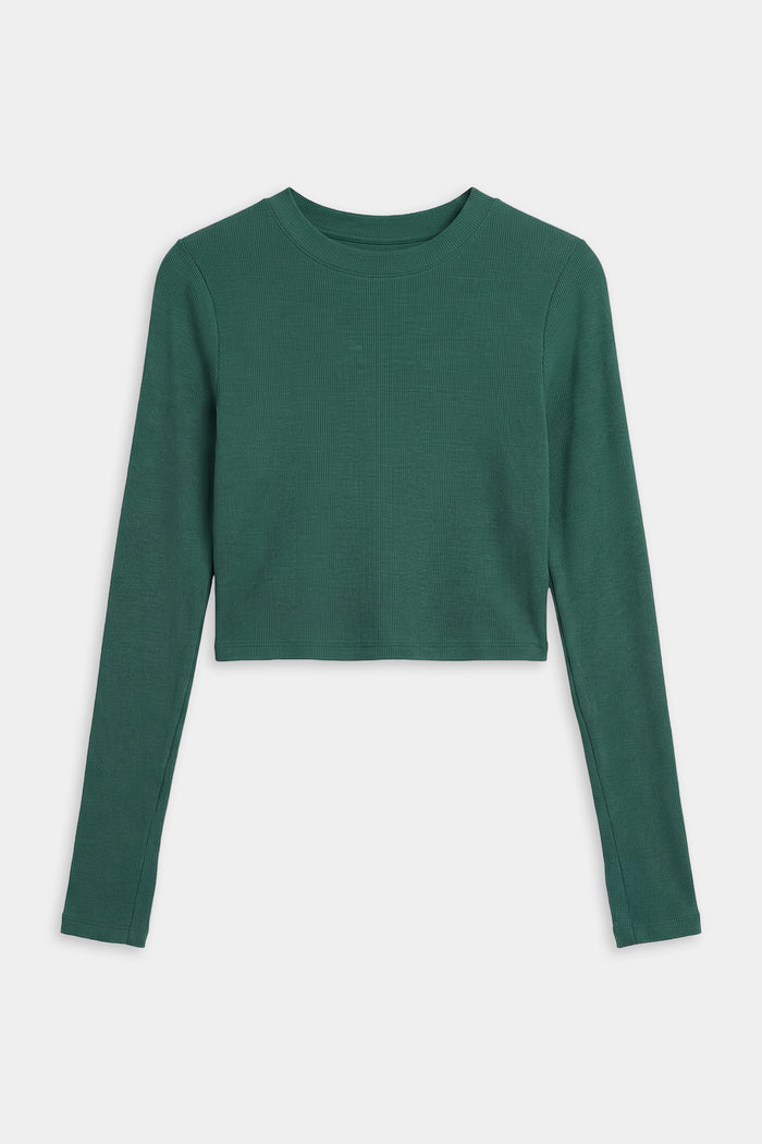 The SPLITS59 Louise Rib Long Sleeve Crop in Arugula, a dark green baby rib crew neck shirt, is shown laid flat on a white background.