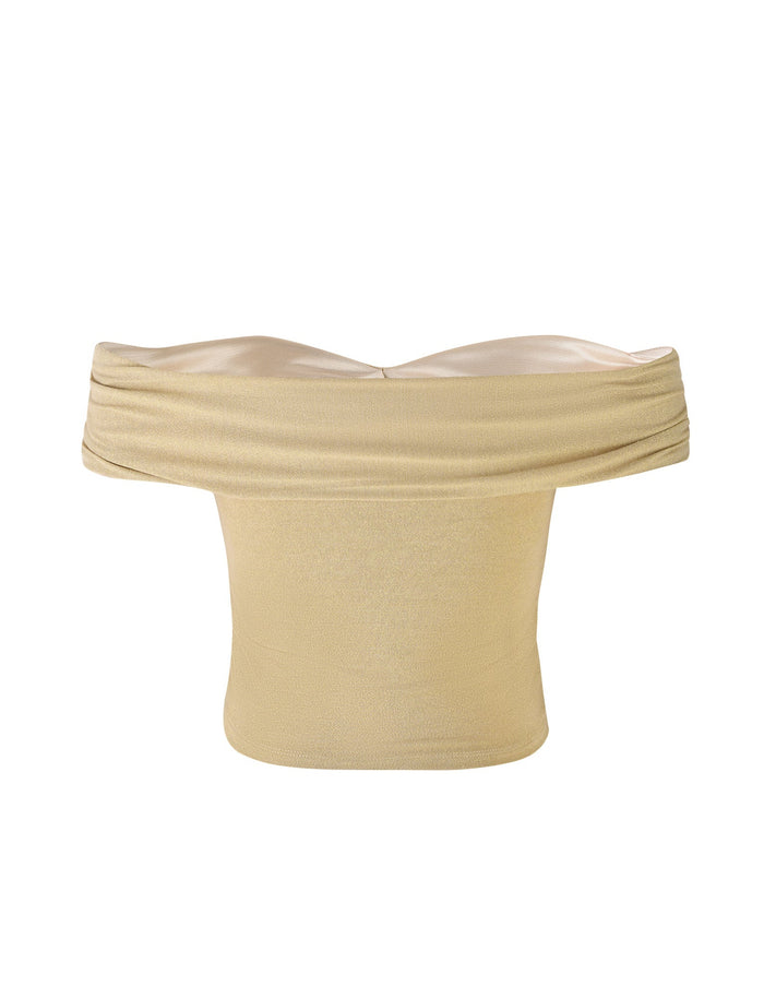 The Lynsey Top in gold from Tiger Mist features an off-the-shoulder design with a slightly ruched upper edge and a fitted bodice. This top has a soft, smooth texture and is designed to sit across the shoulders, leaving them exposed. The material also has a slight sheen.