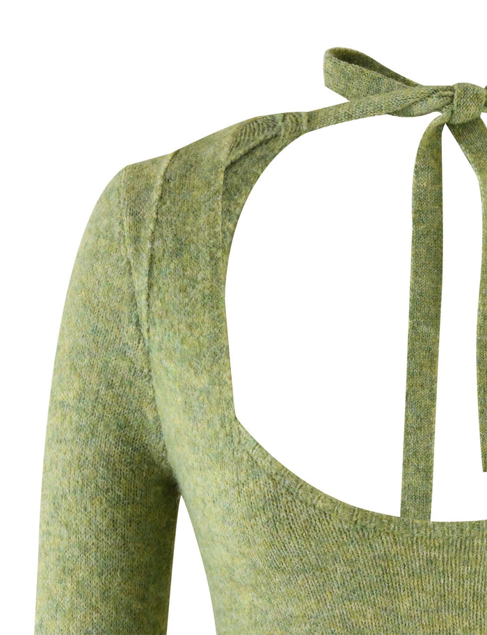 Close-up image of the LYRICA JUMPER - GREEN, crafted by TIGERMIST. This knit sweater features a unique back design with an open back and two straps that tie into a bow at the top. The front showcases a round neckline, and the fabric has a subtle textured pattern.