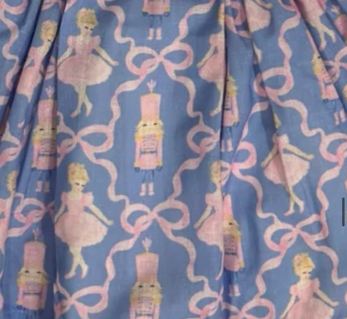 Blue Christmas nutcracker print fabric with pink and gold details