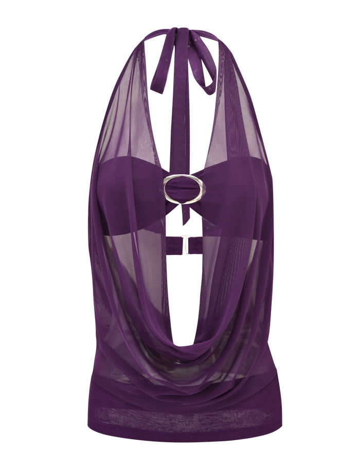 The MAKENA TWO-PIECE TOP - PURPLE by TIGERMIST is a sleeveless sheer mesh halter with a cowl neck and a large silver oval ring at the chest, offering an elegant and striking see-through look.
