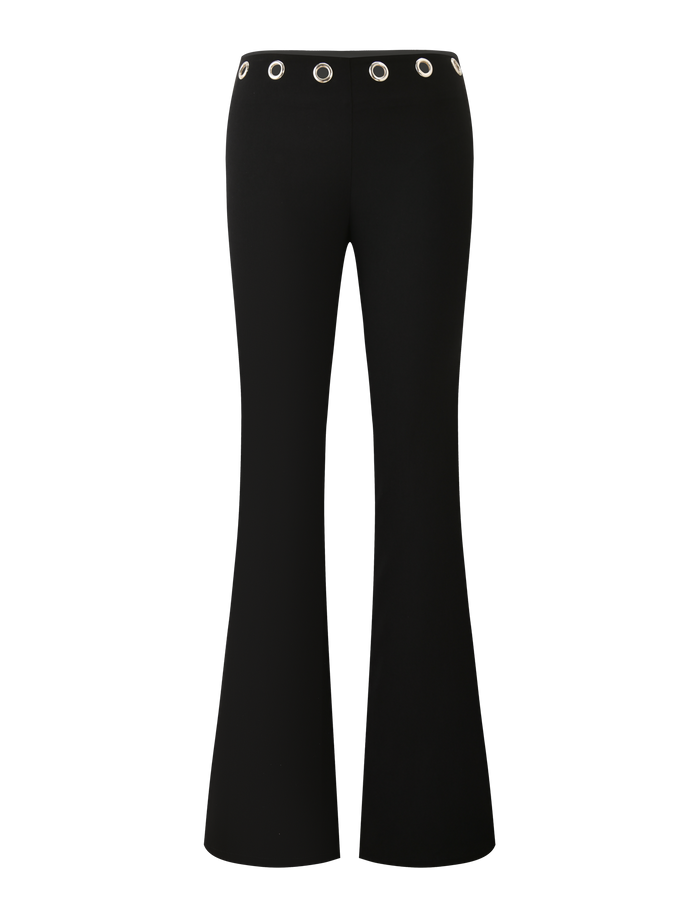 The MARREN PANT - BLACK by TIGERMIST features a low-rise waist and silver grommet details around the waistband, displayed against a white background.