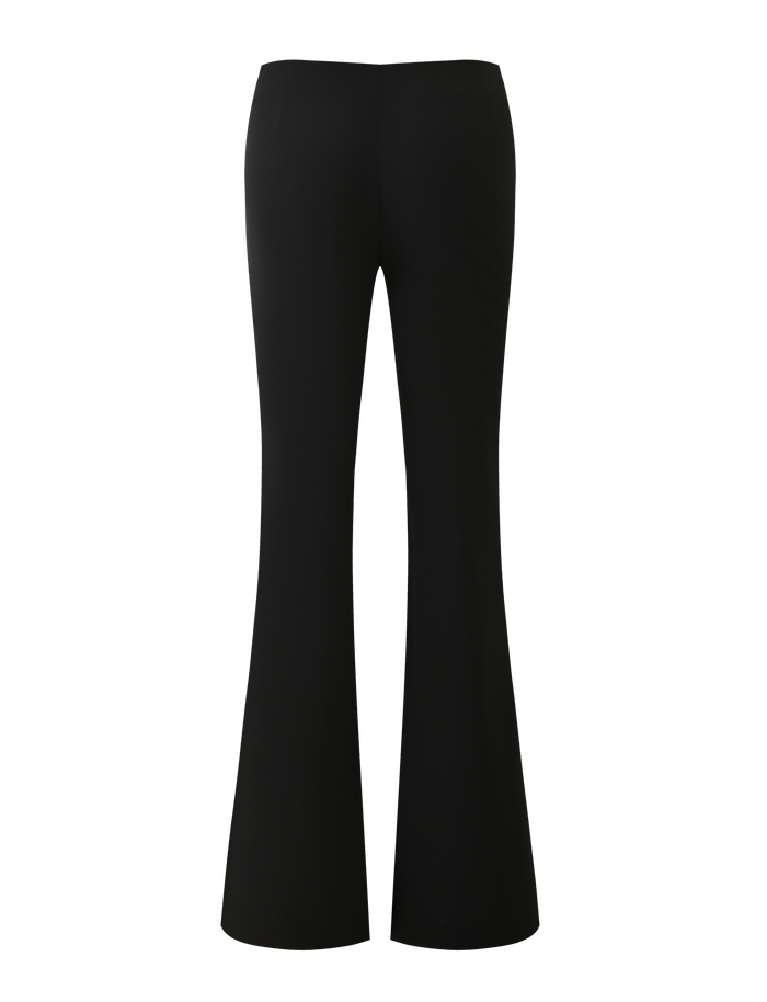 The MARREN PANT - BLACK by TIGERMIST features a low-rise waist, silver grommets, and flared legs, shown from the back against a plain white background.