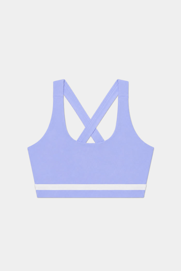 The SPLITS59 Miles Rigor Bra in Purple Haze/White features a supportive racerback design with a white horizontal stripe near the bottom, shown on a plain white background.